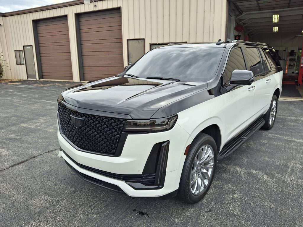 Luxury car with chrome delete and black vinyl wrap on roof, hood, and trim at The Wrench Shack in Naperville & Aurora, IL