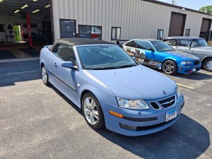 Professional installation of a premium metallic vinyl wrap on a luxury vehicle for a St. Charles, IL client at The Wrench Shack.